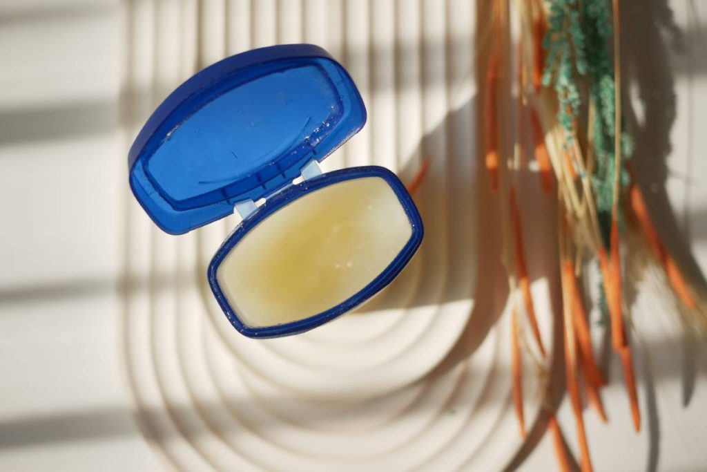 Close up of used petroleum jelly in a container ,
